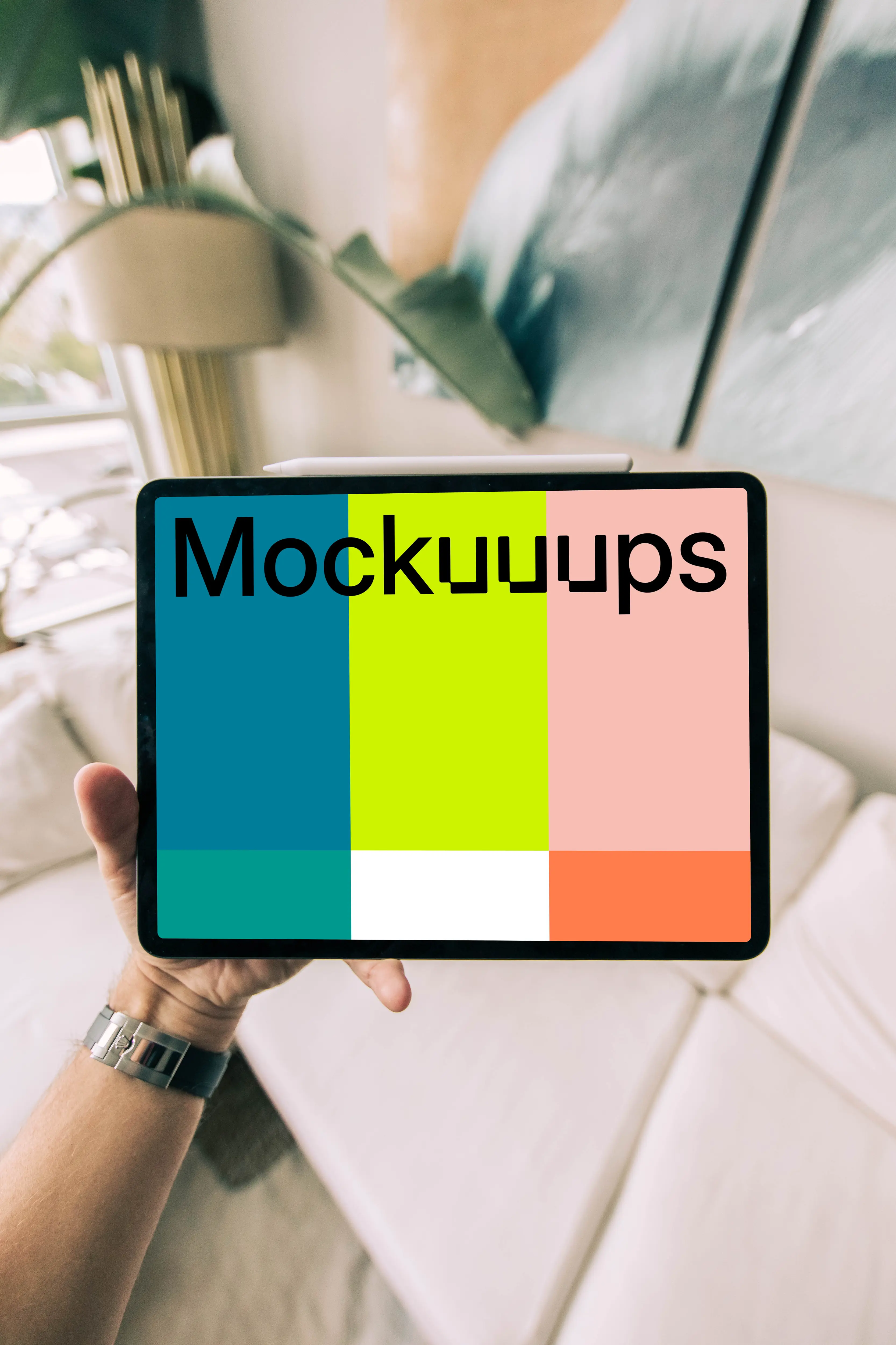 Tablet mockup held by a user over a couch