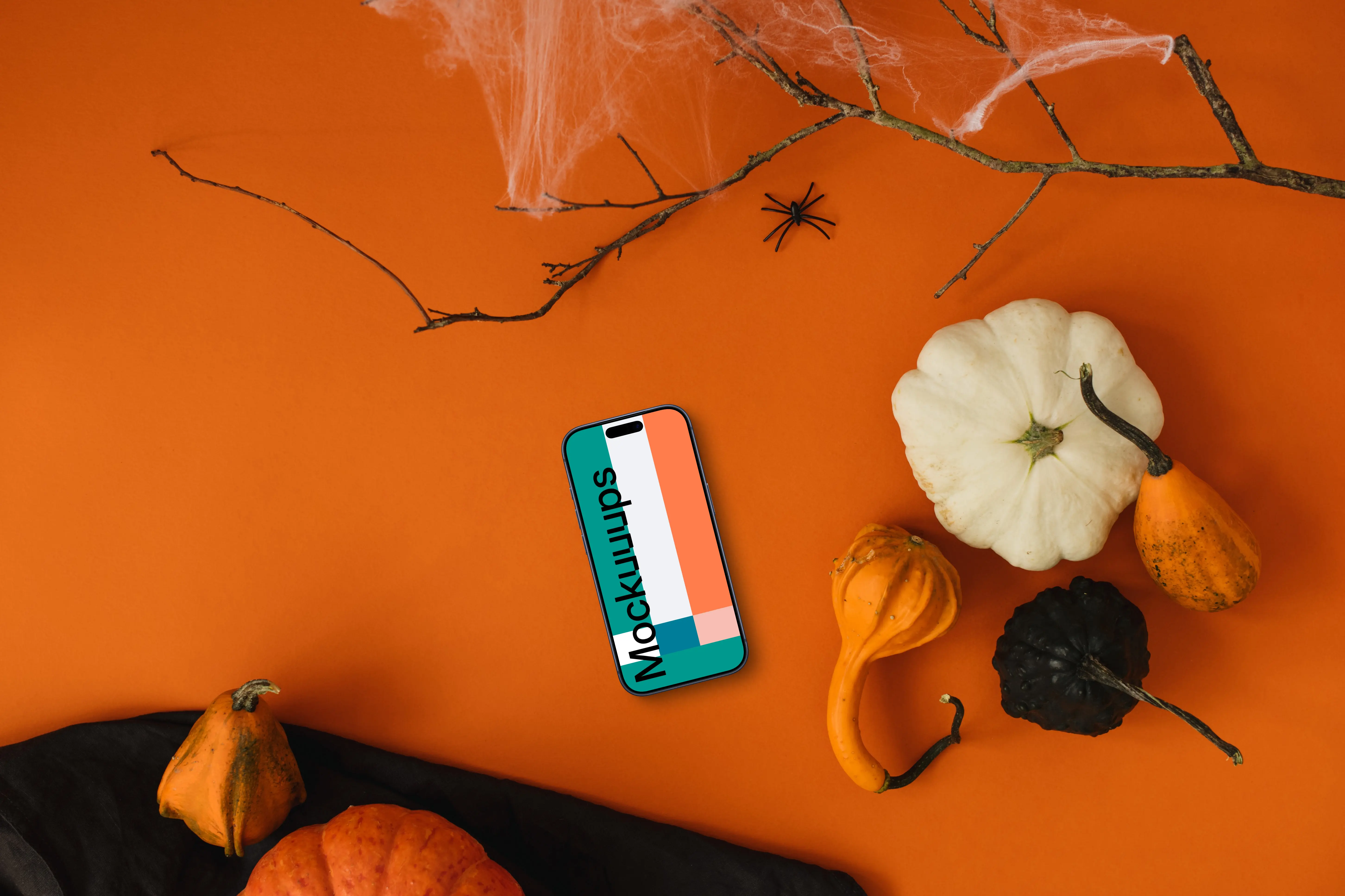 Top view of halloween background mockup with a phone