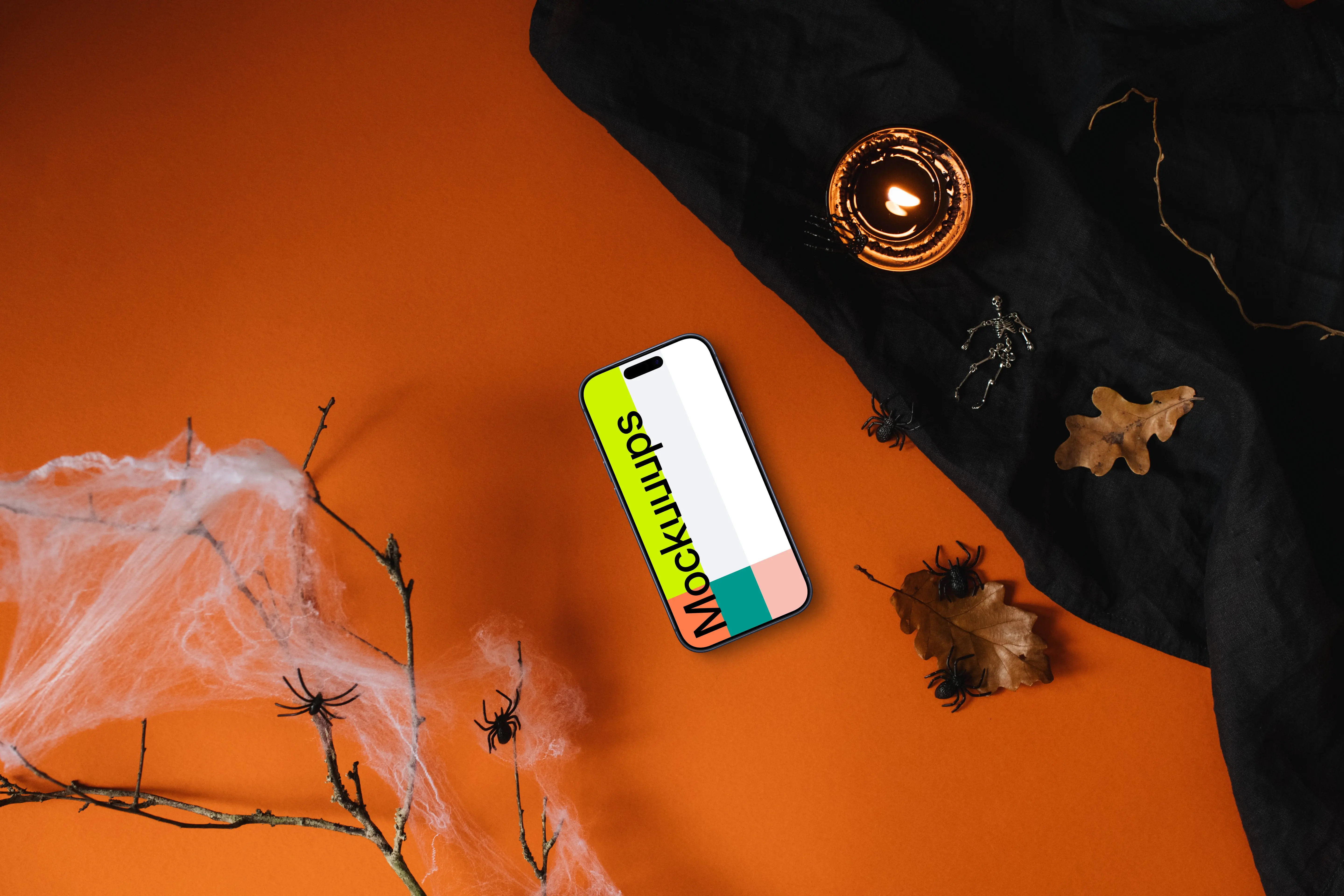 Top view of halloween table with a smartphone mockup