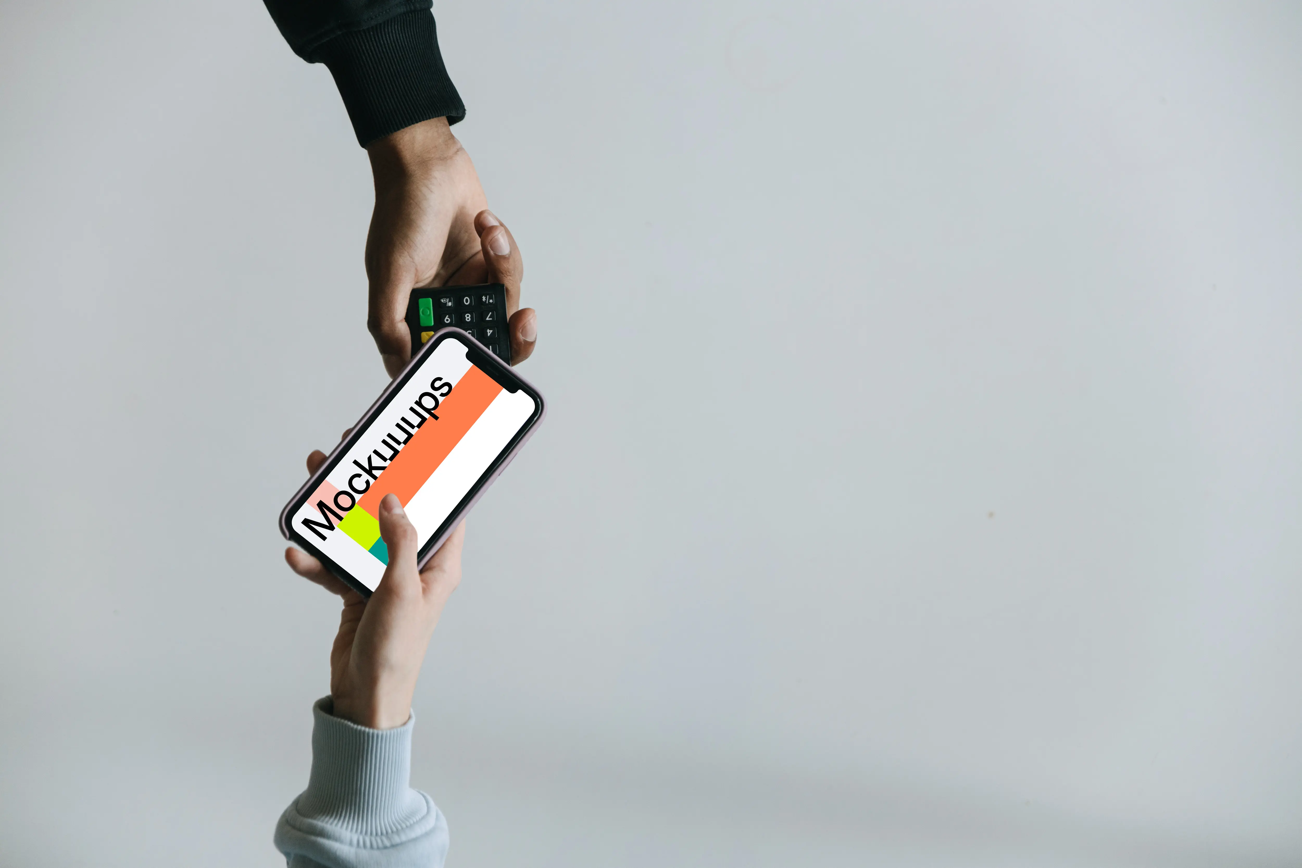 Top view of person using contactless payment with iPhone mockup
