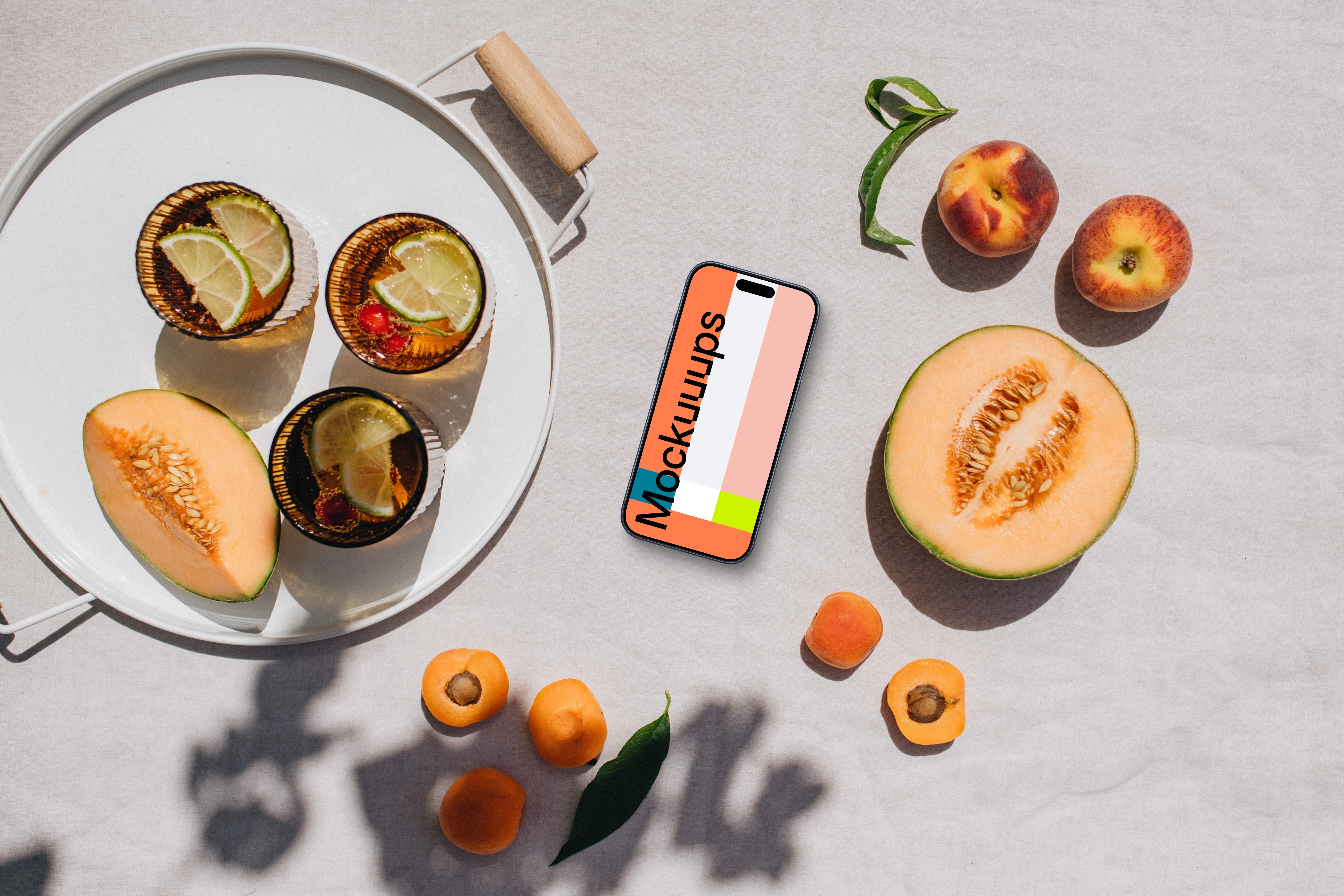 Top view of phone mockup next to the fresh fruits