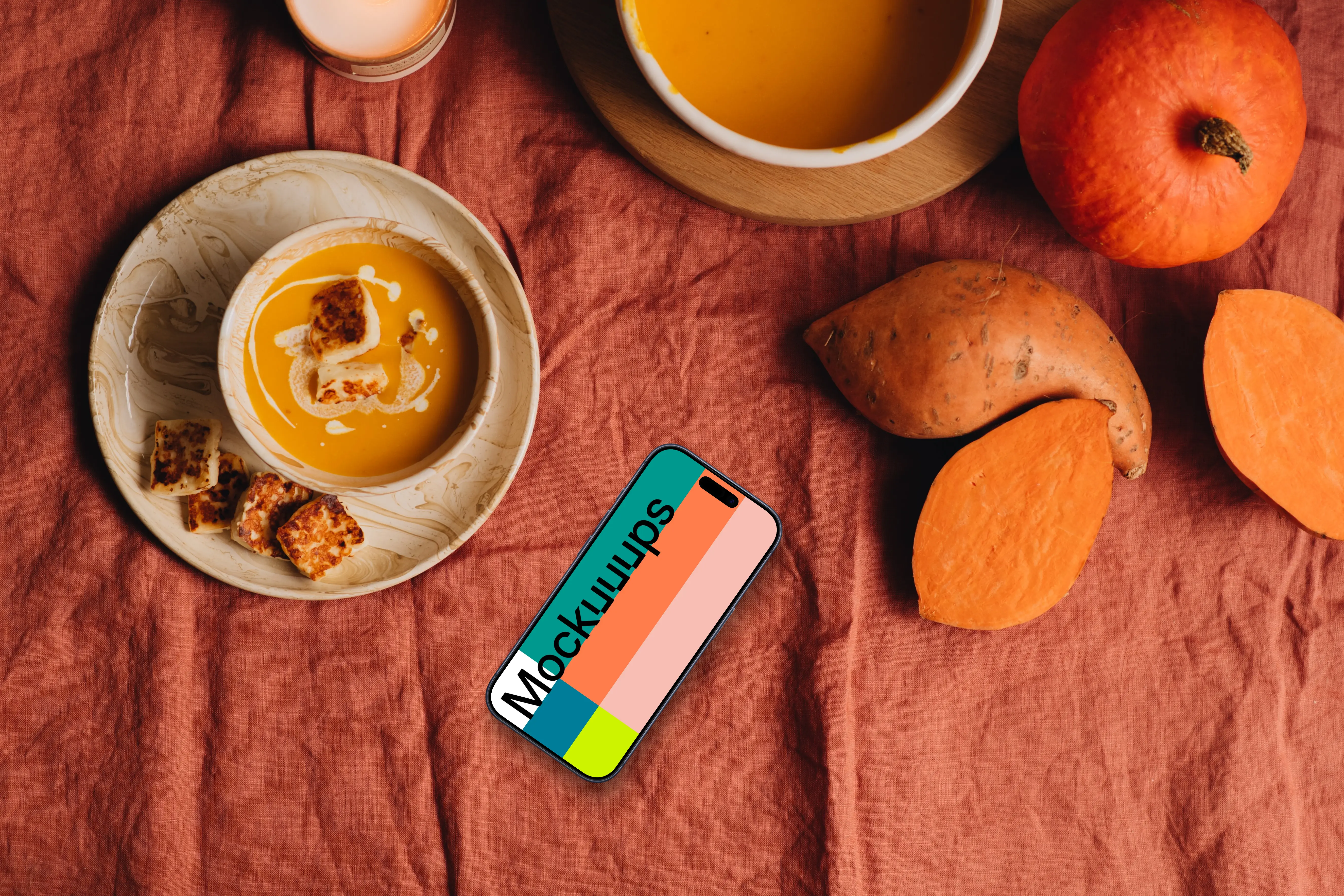 Top view of phone mockup next to the pumpkin soup