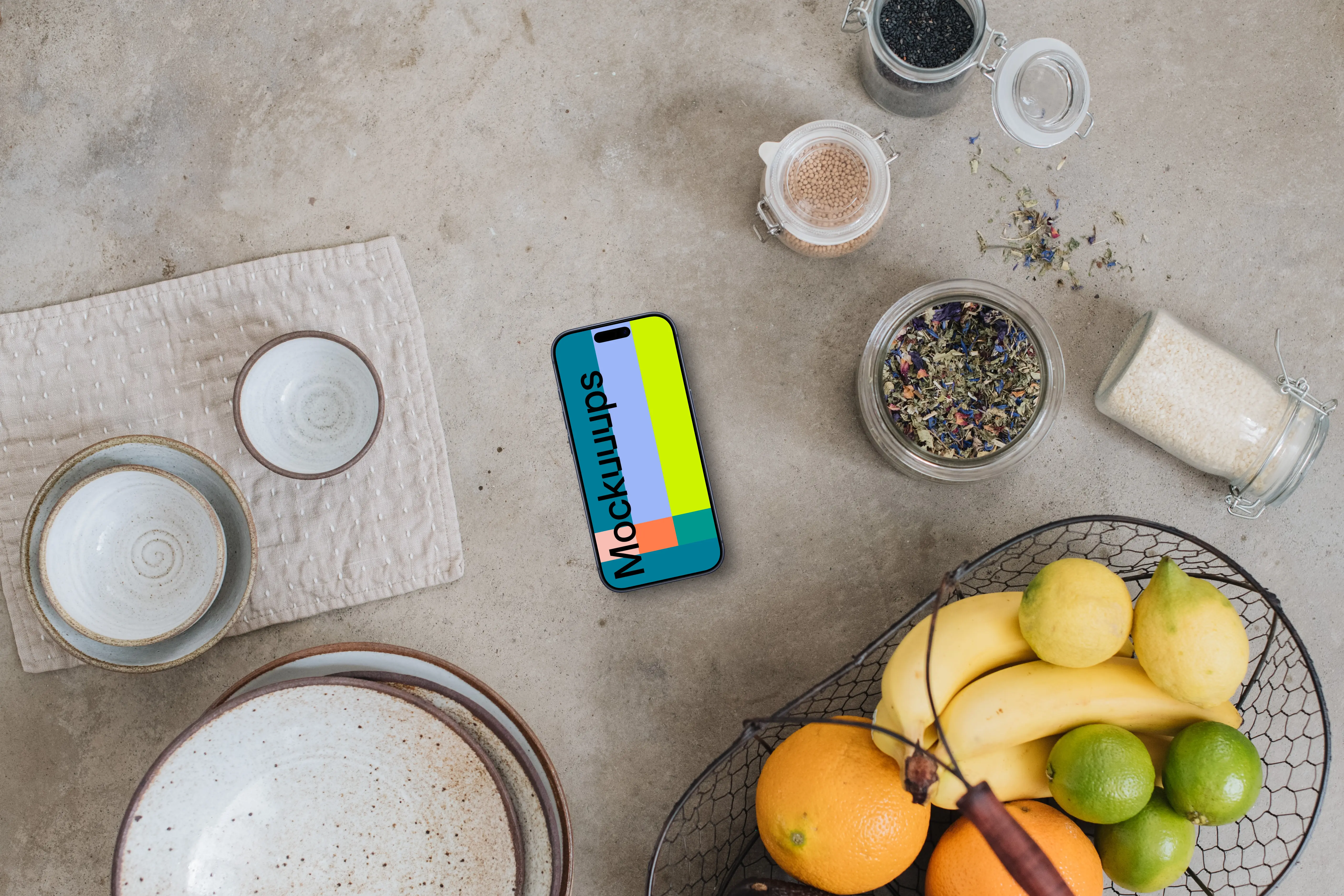 Top view of smartphone mockup next to the basket with fruits