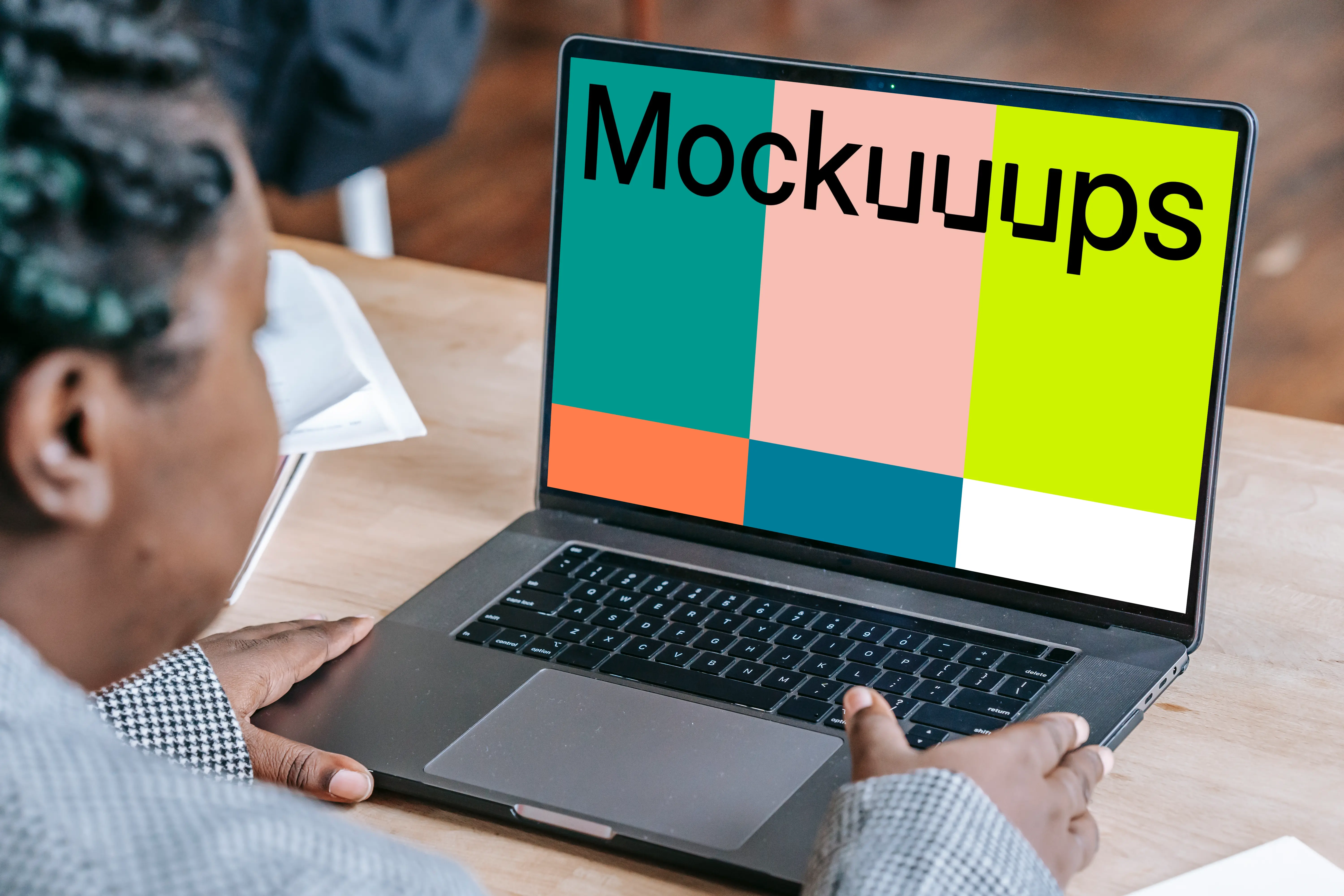 Woman using a MacBook Pro mockup