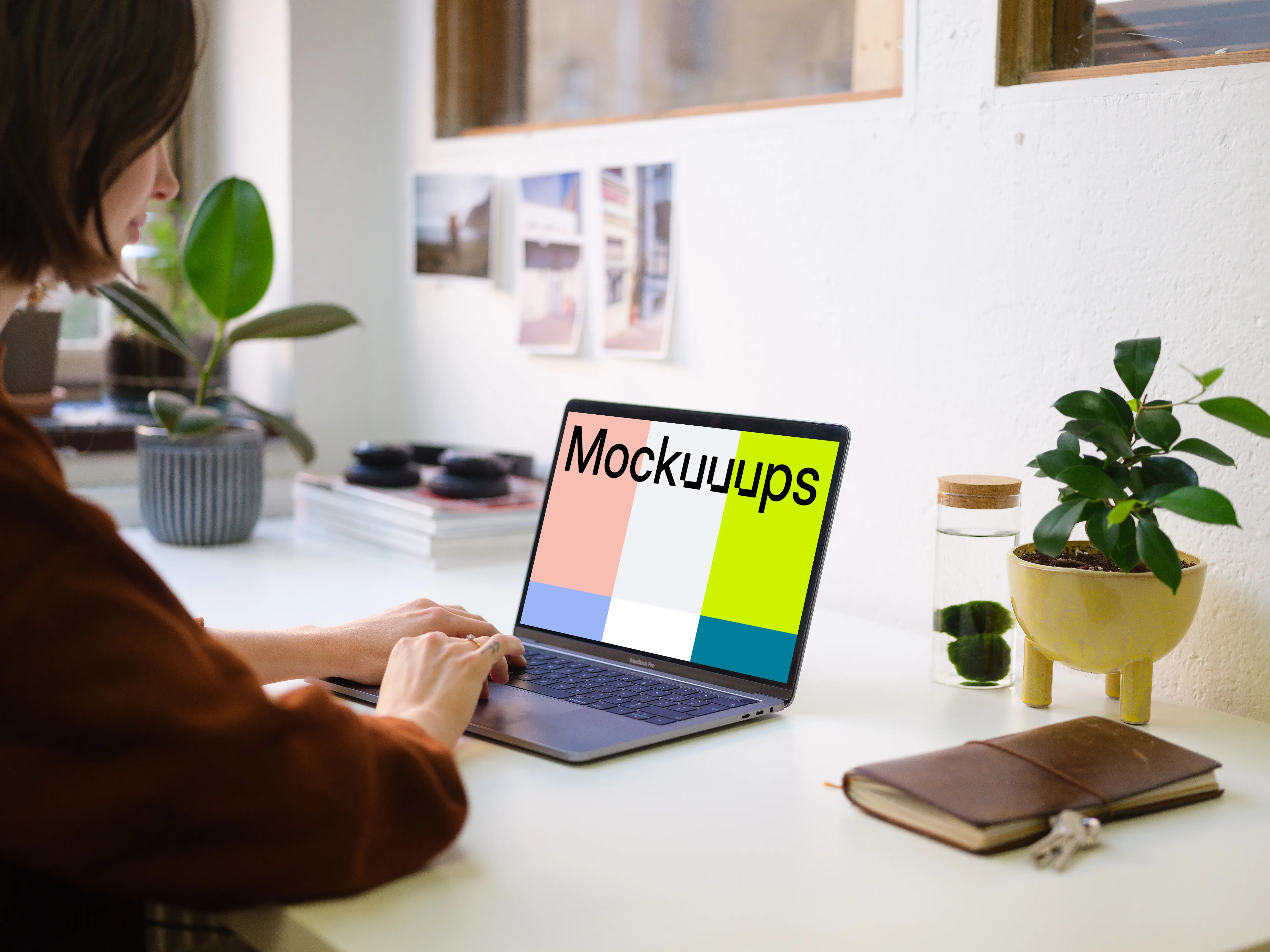 Young woman working on the Macbook Pro mockup