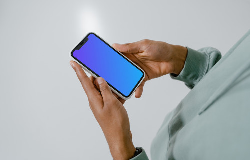 iPhone mockup in user’s hand