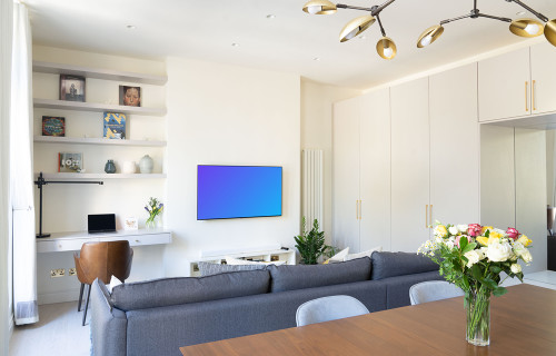 Smart television mockup hung on a wall in a modern apartment