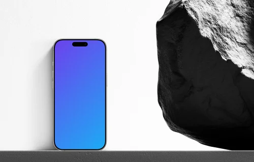 iPhone next to the rock mockup