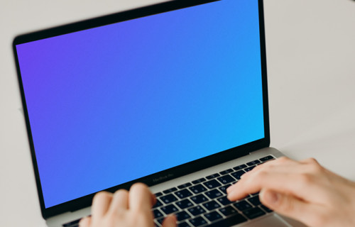 MacBook Pro mockup on a white table (front view)