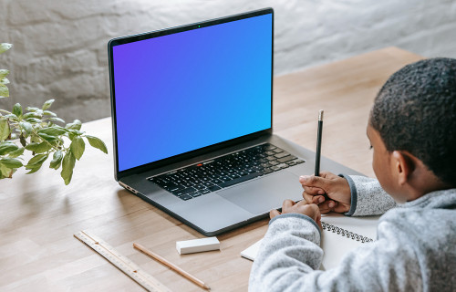 Young boy using laptop mockup