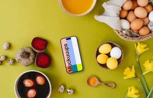 Easter eggs being colored around a smartphone mockup