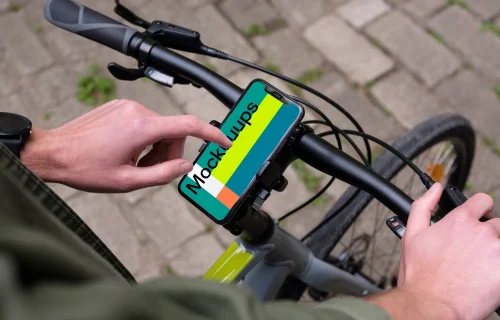 Tapping on iPhone 11 Pro mockup mounted on a bike