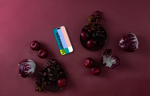 Food in Viva Magenta color shade next to the phone