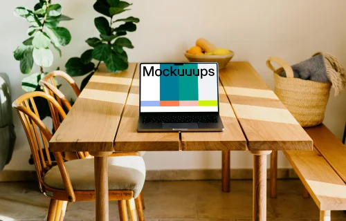 Grey MacBook Pro mockup on a wooden table