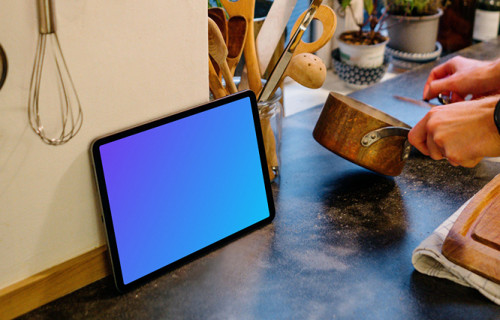 iPad Air mockup beside various cooking utensils