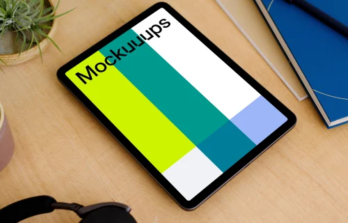 iPad Air mockup on a table beside a diary