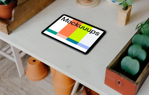 iPad mockup placed flat on a white table