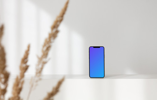 iPhone leaning on a white wall mockup