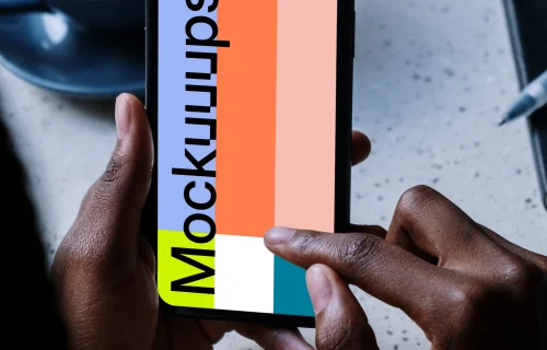 iPhone mockup beside a cup of coffee