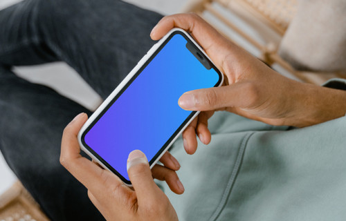 iPhone mockup held on a chair by user