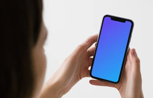 iPhone mockup held up by a woman