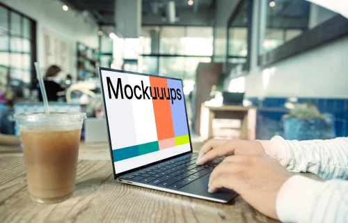 Dell XPS Mockup on table with drink at the side