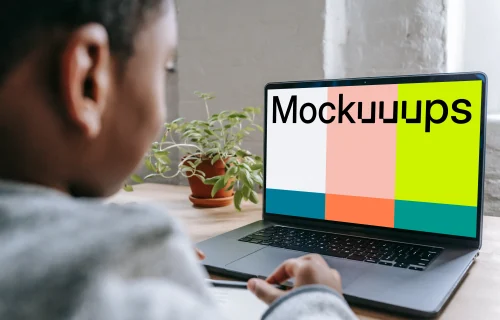 Little boy using a gray MacBook Pro mockup