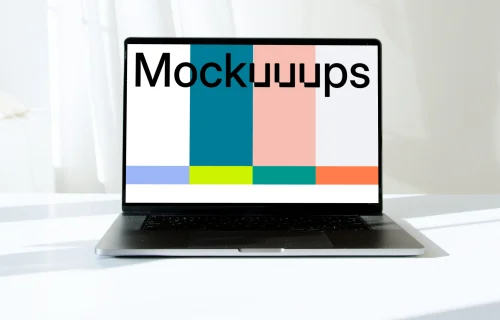 MacBook Pro mockup in full view on a white table