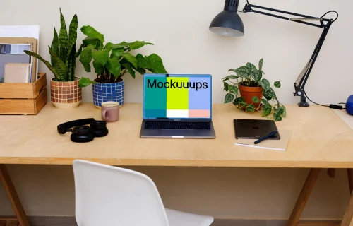  MacBook Pro mockup on a light brown table.