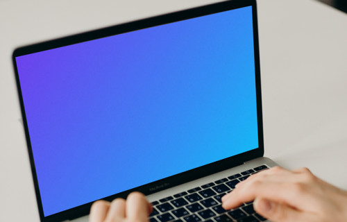 MacBook Pro mockup on a white table (front view)