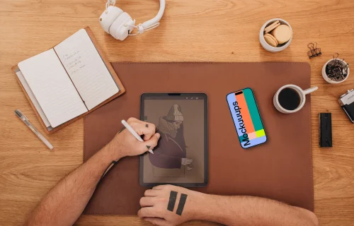 Male hands and smartphone mockup on the work desk