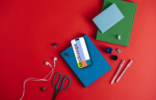 Phone mockup lying on the book