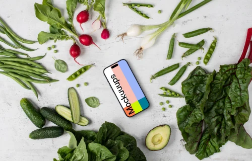 Smartphone mockup in the middle of vegetables