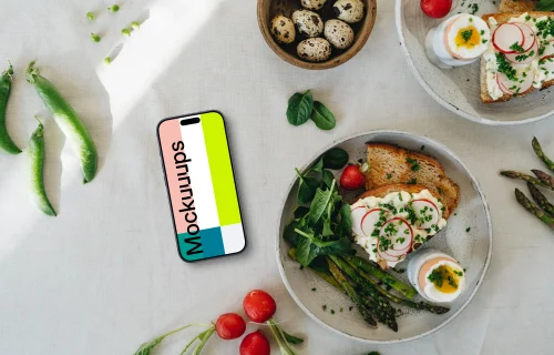 Smartphone mockup on a table with an Easter meal