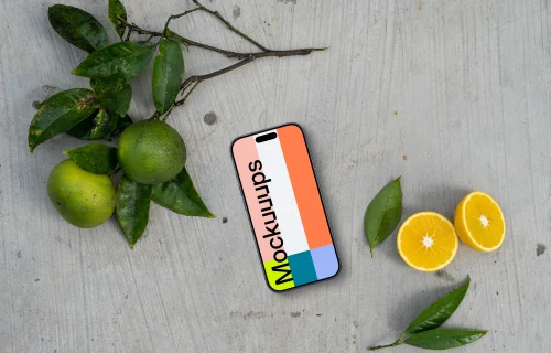 Smartphone mockup on a table with citrus fruits