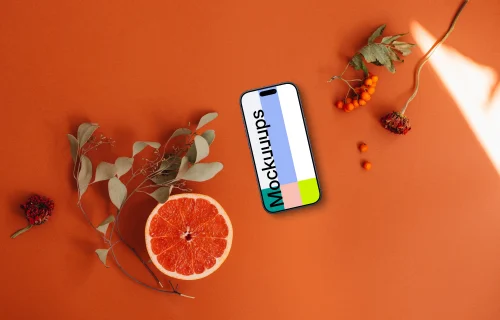 Smartphone mockup on vivid orange background