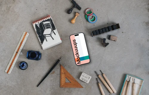 Smartphone mockup with a brush and ink on the side