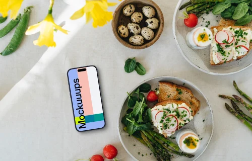 Smartphone mockup with Easter snack and yellow flowers