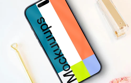 Smartphone with white and pink peonies and golden accessories