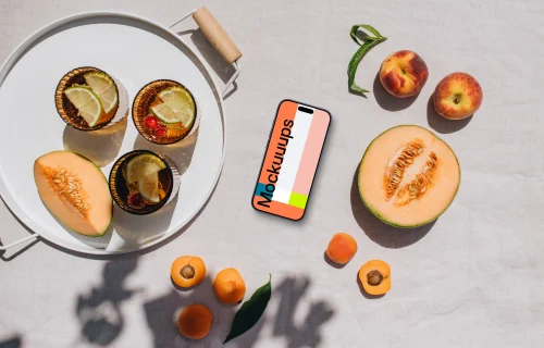 Top view of phone mockup next to the fresh fruits