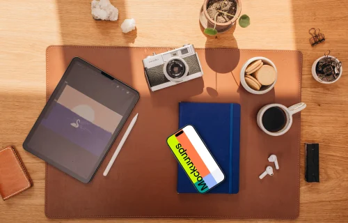 Top view of smartphone mockup on the office desk