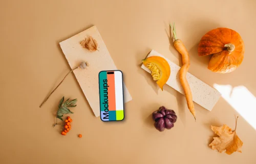 Top view of smartphone mockup surrounded by vegetables