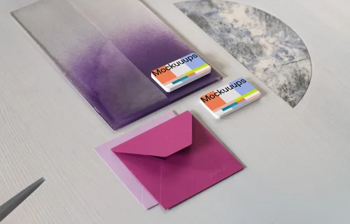 Two business cards mockup with colorful envelopes on textured surface