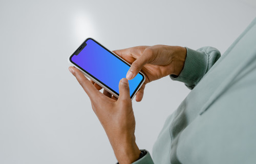 User typing on his iPhone mockup