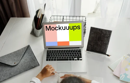 Young girl studying with her white MacBook Air mockup
