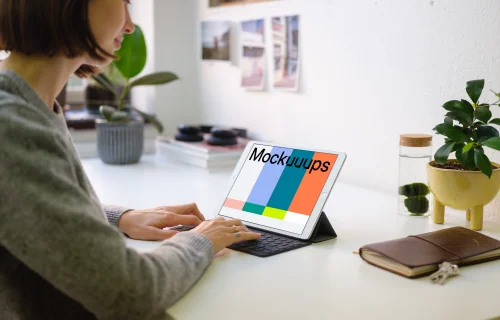 Young woman working on the iPad Pro mockup