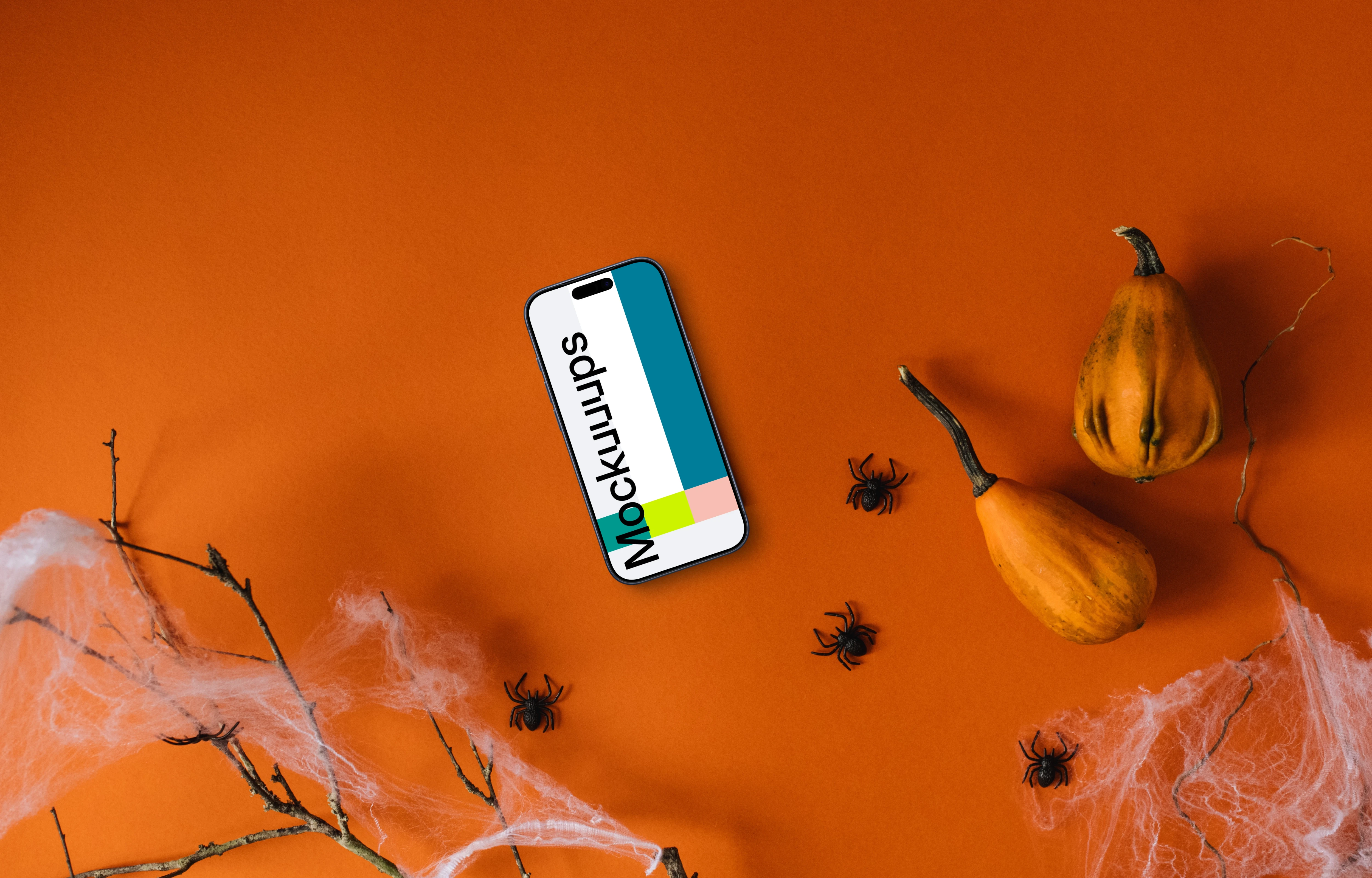 Halloween background mockup with a smartphone and spiders