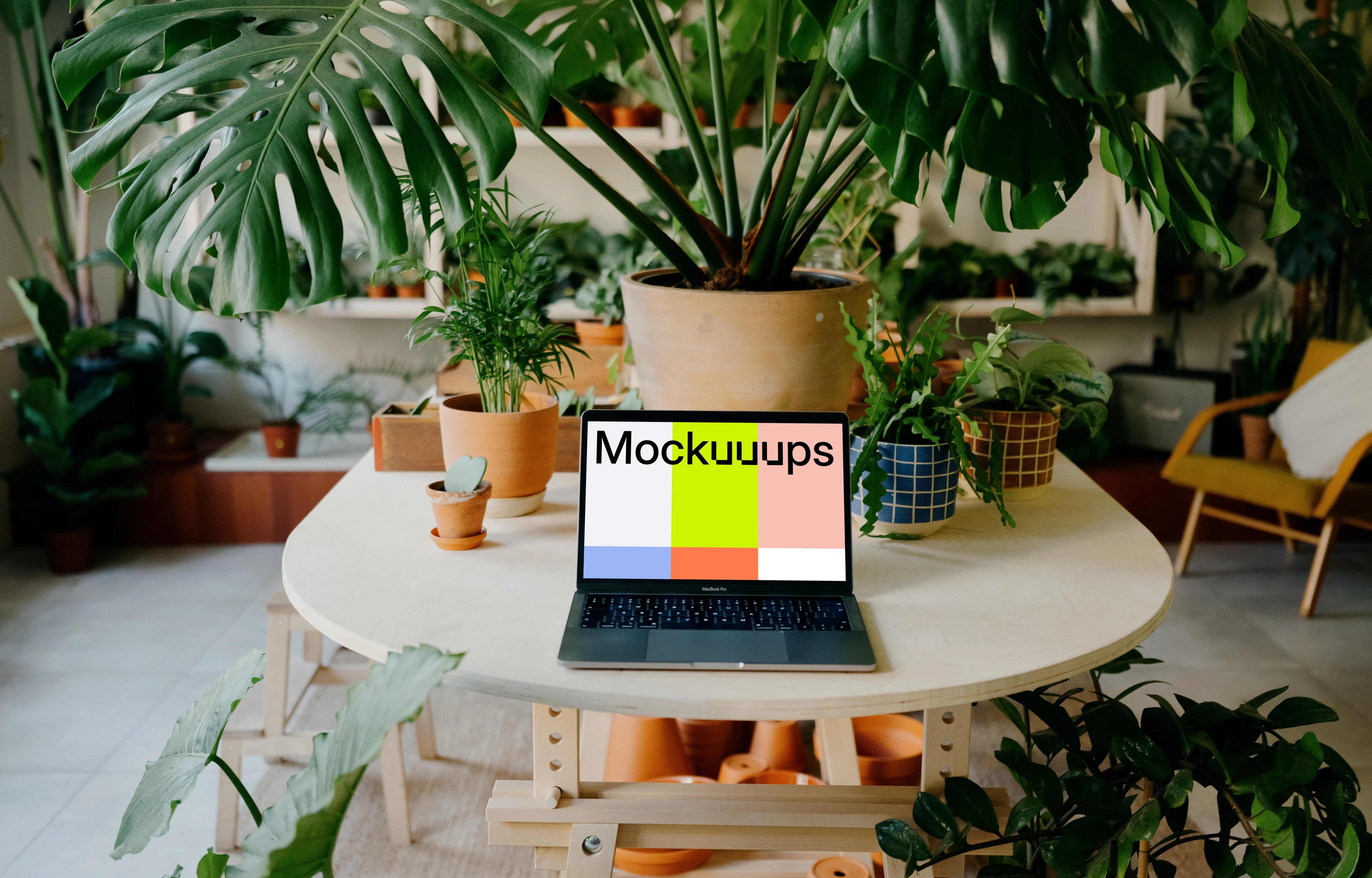 MacBook Pro mockup amidst an indoor garden