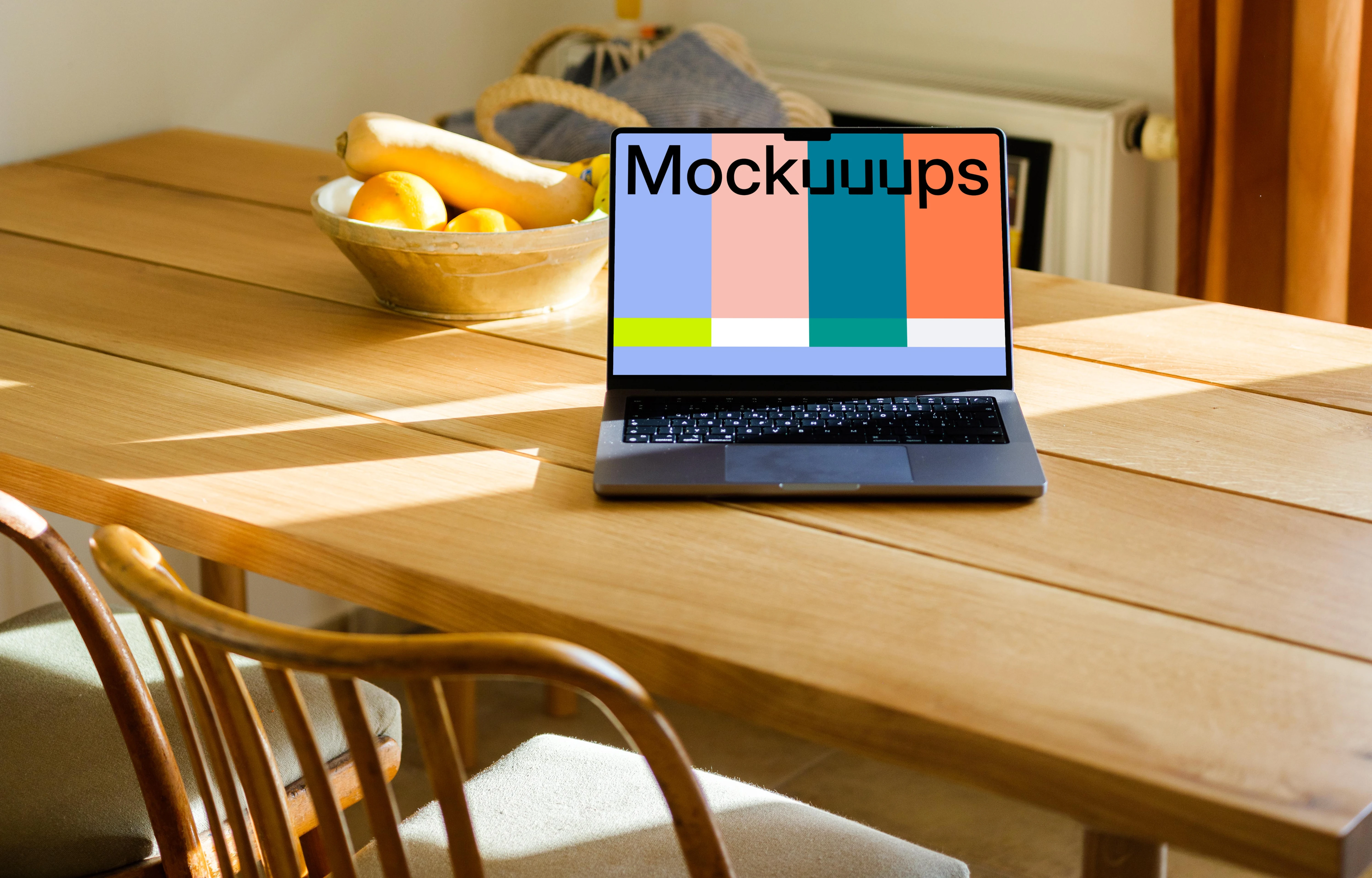 MacBook Pro mockup on a table in front of a fruit basket 