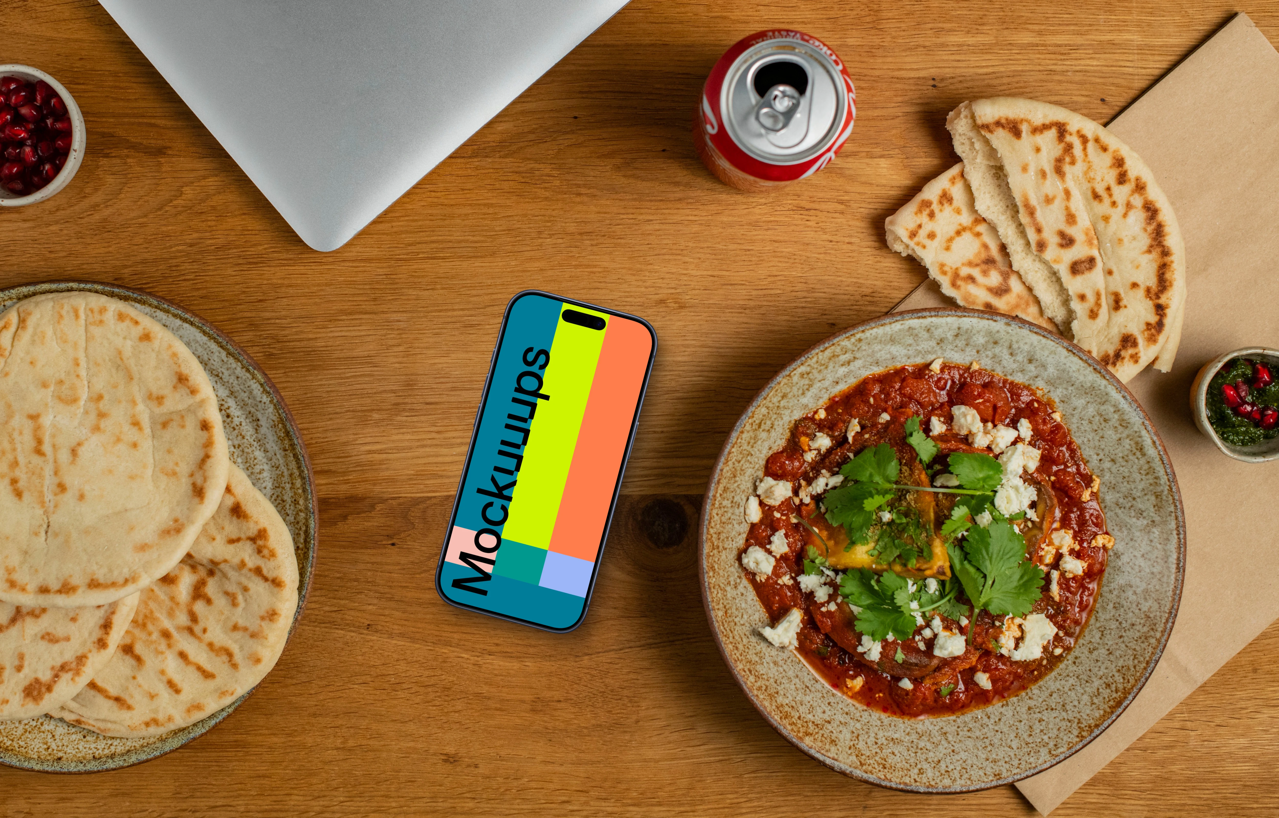 Smartphone mockup next to the Muhammara